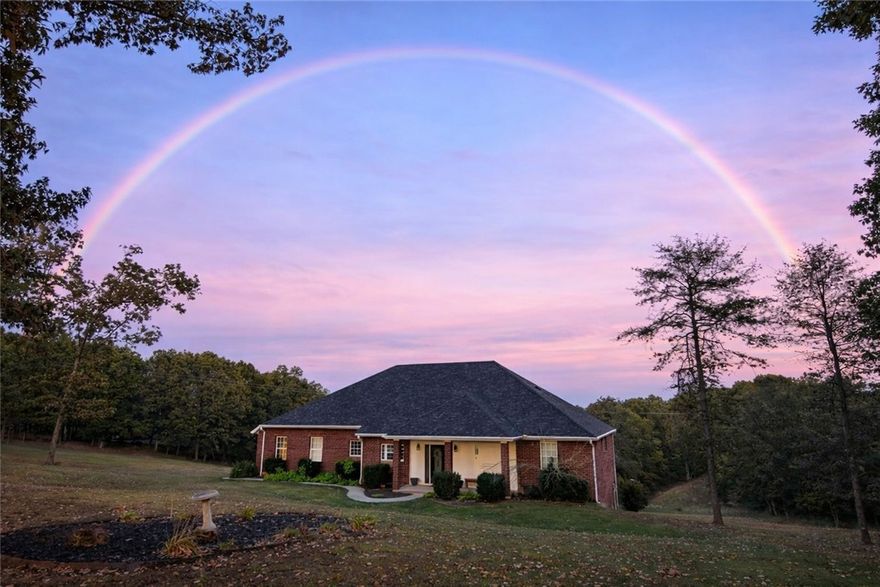 You may have noticed this home has a few extra days on market, so let’s clear that up first. There’s nothing wrong with the house. In fact, visitors consistently comment on how solidly it’s built and how much they love the layout. The difference here is the land: rather than five flat acres, this property sits high on a scenic ridge overlooking a valley.

The result? Big views, incredible privacy, and far less mowing. Think of it less as acreage to maintain and more as your own private hillside retreat.

Located just minutes from Huntsville and about 30 minutes to Springdale and Fayetteville, the setting offers elevation and scenery that flat properties simply can’t replicate.

Inside, the light-filled main level is perfect for everyday living or entertaining. The finished walk-out basement, currently a home gym, could easily become a media room, guest suite, or in-law space. Built in 2008 with a new roof and HVAC in 2023 and recently appraised near $600K.