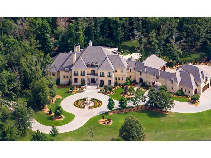 Magnificent 14,700 square foot custom built European manor sits on 3.84 tranquil acres. This estate consist of 9 climate controlled garages, a fabulous saltwater pool, spa, & 3 loggia areas. The home offers a 3,500 bottle wine cellar w/dining/tasting,room a theater room, exercise & game room, 4 staircases and a stained wood paneled elevator. Handscraped wood floors, "Smart Home" technology. Stucco exterior. 2nd floor laundry, Porte-cache, natural gas powered emergency generator. 8 HVAC units.