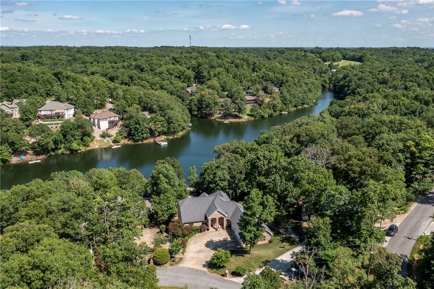 Lake Front Living at its Best! Custom-Built, One Owner Lake Brittany Home! An entertainer’s dream home with a Contemporary Designed Floorplan with amazing lake views from all levels. Two Story Wall of Windows in the living room greet you with floor-ceiling stunning fireplace. A true gourmet kitchen with high-end appliances, gas cooktop, wine fridge, and large granite island, open to a large dining area and living room. Open loft area perfect for your home office, or great flex pace! Master Suite features cozy fireplace and large master bath with contemporary features. Basement Level features an amazing Theater Room, 3 bedrooms, 2baths, family room with kitchenette, extra storage. Easy walk to the water and private boat dock down a beautiful, landscaped path, raised vegetable garden and koi pond! Detached Workshop/Storage Building, 3 Car Garage. This home has been lovingly cared for and pride of ownership shows. Never leave home as this one has all you need to enjoy the good life!