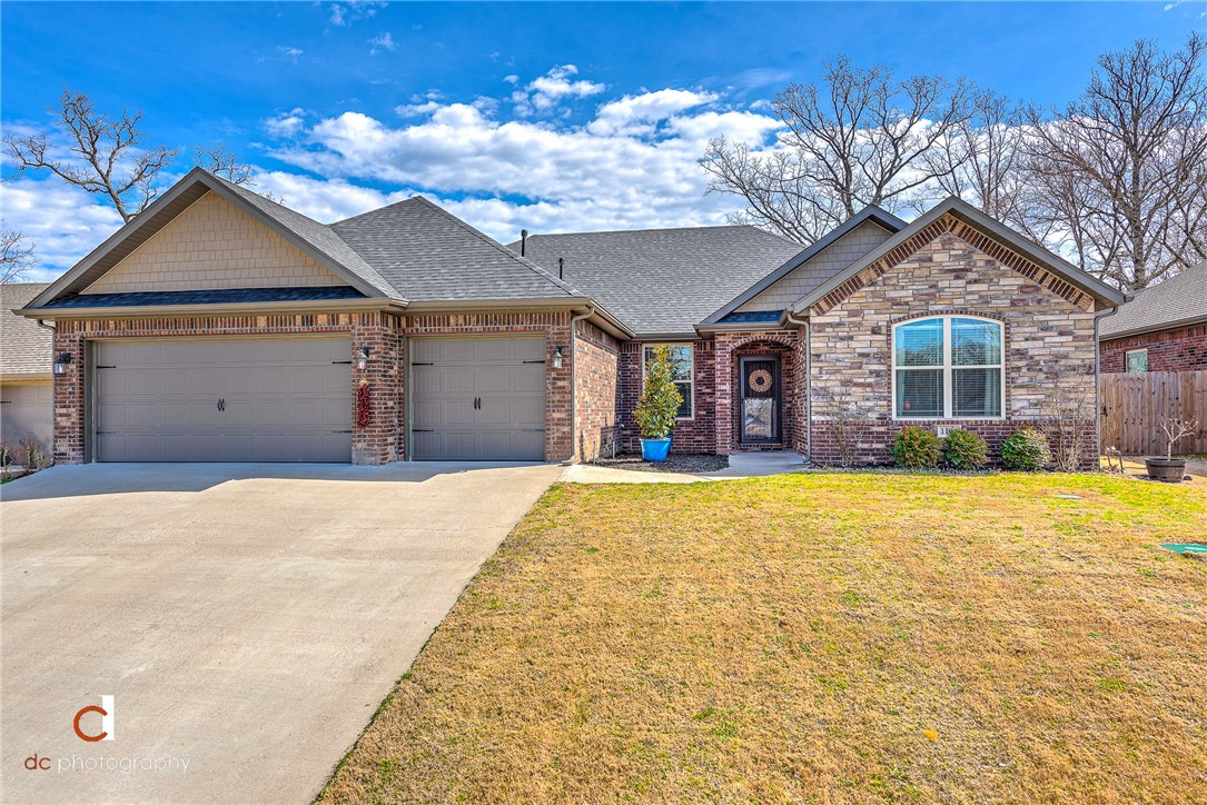 Welcome to 1104 Sycamore! This beautiful home is thoughtfully designed with spacious rooms, and great outdoor living spaces. Zoned for Bentonville Schools and the new Evening Star Elementary! Split floor-plan that accommodates family needs with a kitchen and living area great for entertaining. So many upgrades! Knotty pine cabinetry, gutters, sprinkler system, walk-in pantry, storm doors, central vac, hand scraped hardwood flooring in main areas, Ring doorbell and extended back patio set this home apart, and a connecting laundry room to the master closet create ease in laundry day!