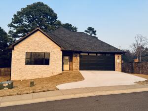 One of Russellville's newest gated subdivisions with a front row seat to the beautiful Lake Dardanelle. High quality design throughout and easy maintenance exterior!