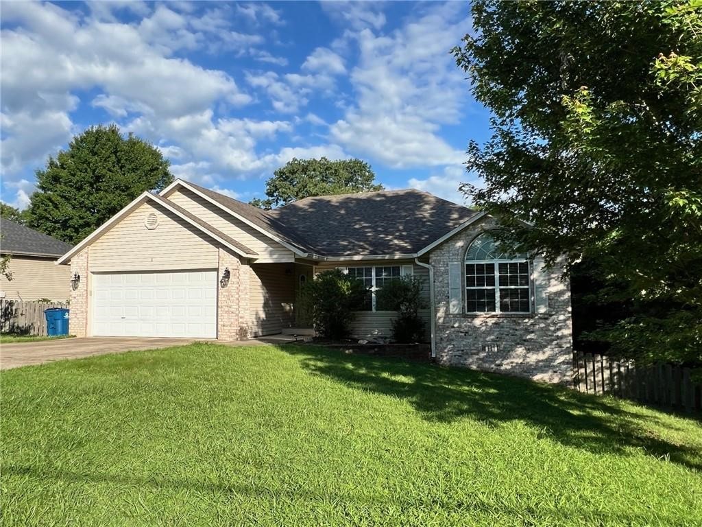 Great home with a large fenced backyard and covered deck! This 3 bedroom 2 bath home is ready to move in! Home features: fireplace, wood and tile floors, 2 car garage, central heat and air and ready to move in! The refrigerator is included as a courtesy to the tenants.