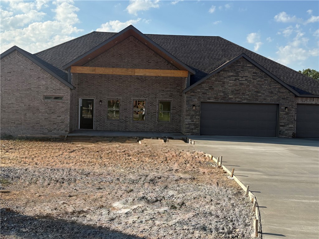 Welcome to 1951 Lordsburg Court, a stunning 4-bed, 2.5-bath home nestled on a nearly half-acre lot. As you step inside, you’ll notice the bright, open floor plan & high-end finishes throughout. The spacious living room includes a cozy fireplace, wood beams, & natural light. The kitchen comes complete with a large center island, quartz countertops, stainless steel appliances, & ample cabinetry. The split floor plan ensures privacy, with the master suite tucked away for ultimate tranquility. The master bath includes a soaker tub built into a large walk-in shower with both a rainfall & regular showerhead. The master suite also boasts a generous walk-in closet with built-in vanity for added convenience. Outside, the large covered porch provides an ideal spot to unwind. Additional features of the home include a 3-car garage. Situated in a sought-after neighborhood with easy access to Bentonville's top-rated schools, parks, dining, & shopping, don’t miss the chance to make this exceptional home yours!