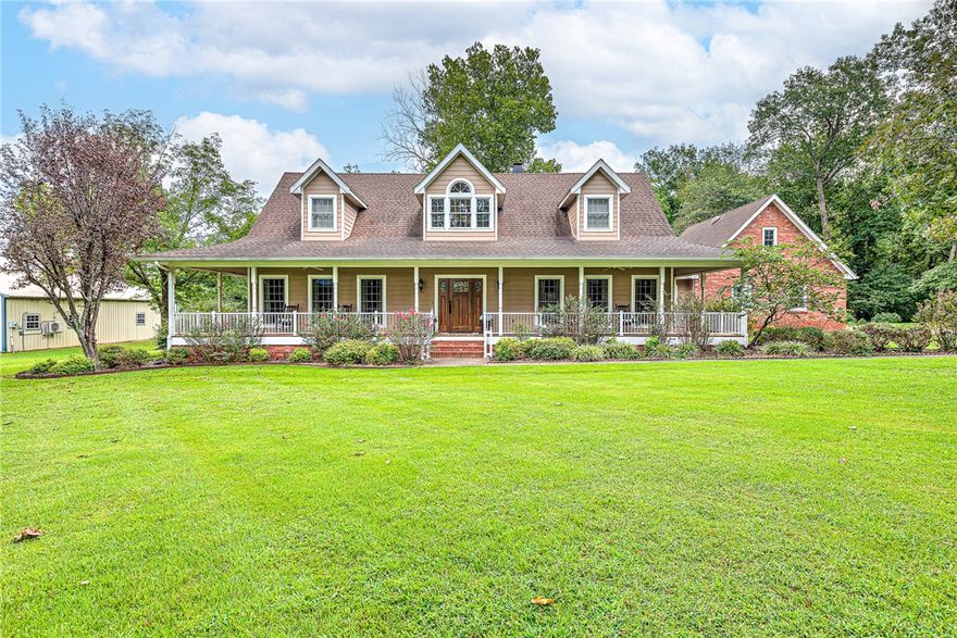Custom built craftsman style home nestled on 2.5 acres with wrap around porch and large back deck. This beautiful home is open, spacious, and perfect for everyday living or entertaining. Kitchen features granite countertops, stainless steel appliances, double oven, and abundant cabinetry. This 3400 sqft home has 4 bedrooms and 2.5 baths, formal dining, breakfast room, sunroom, and more. Included is a 240 sqft shop remodeled for a tanning salon, but could be perfect for an office. It has electricity and 2 wall heat/air units.