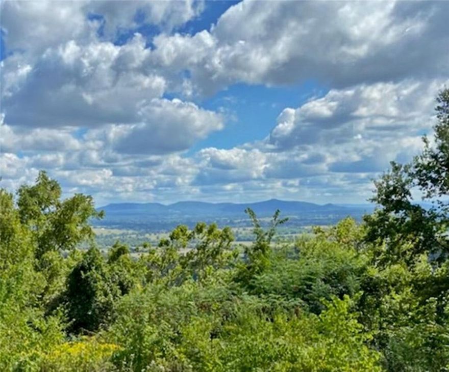 MILLION DOLLAR VIEW looking over Gaither Valley.   There is 700 highway frontage (2 acres m/l), and the other 4 acres with access from Mountain Road and Black Jack Road.  There are lots of trees to cut.   This highway 43 goes to the head of the National Buffalo River and where you can usually see lots of elk.  And if hiking the trails or floating- you can get supplies at the general store and get information.  The view is priceless! And easy access to get back to town.