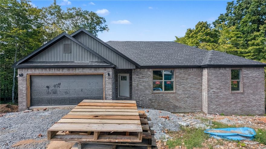 Welcome To Your Next Home! Tucked Into A Prime Spot In Bella Vista With Easy Access To 71B, Lake Ann, And Some Of The Best Mountain Bike Trails Around—This One’s Got The Vibe And The Location. Step Inside To 9 Ft Ceilings, A Wide-Open Living Area Offering Easy Furniture Placement, And A Corner Fireplace. The Kitchen Is A Total Win With Custom Cabinets, Granite Counters, Tile Backsplash, Under-Cab Lighting, Pantry, Island Seating, And Eat-in Dining. The Primary Suite Delivers A Walk-In Closet Built For Real-Life Storage Goals, And A Soaker Tub, Tile Shower, Dual Vanity In Primary Bath. Two Additional Rooms And A Full Hall Bath With Double Vanity Round Out The Floorplan. Out Back, You’ve Got A Covered Deck That Steps Down To A Sodded Yard Ready For Whatever You've Got Planned. Deeded As A 2-Bed Septic. 3rd Room To Be Considered Office/Bonus/Other Non-Sleeping Room. Signed Agreement Required.