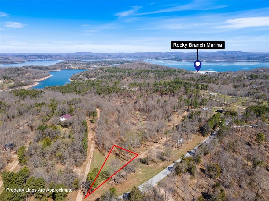 Plant new beginnings with a cabin in this .7 acre lot in the Rocky Branch Resort area. Land perked for a 2 bedroom house. Electric nearby with municipal water at Rocky Branch Road. About a mile and a half from swimming area and public boat launch at Rocky Branch State Park and Marina. Nearby Hobbs State Park hiking and biking trails, War Eagle Mill and Caverns. Additional lots available.