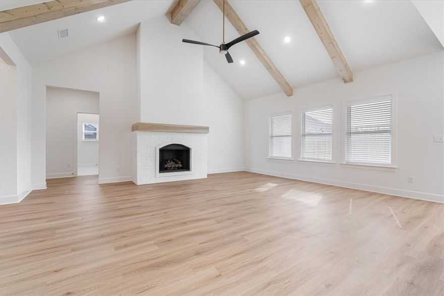 Builder is offering up to $7,500 towards closing costs, interest rate buy down or towards an appliance package! The "ROSS" plan boasts a spacious single story open-concept layout with luxurious finishes including vaulted ceilings, quartz countertops, inviting entry way, upgraded lighting fixtures, custom cabinets, black stainless steel appliances, gas fireplace, gas range, oversized tiled walk in shower in primary bathroom with rainfall shower head & luxury vinyl plank floors throughout. Enjoy standard inclusions such as insulated garages, full home gutters, privacy fence, & 2” blinds throughout. Community pool coming in Phase 2! Under 10 minutes to XNA Airport and under 20 minutes to Downtown Bentonville and New Walmart Campus. Photos are sample photos only. South Facing!