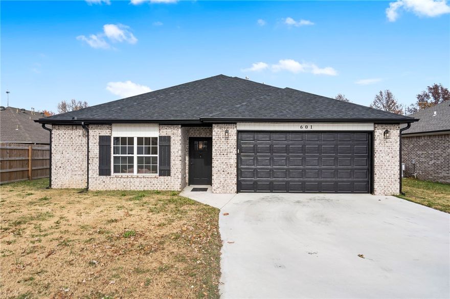 Built in 2024 by a respected local custom builder, this 1,620 sq ft. brick home offers the perfect blend of style, comfort, & functionality. Featuring 3 spacious bedrooms & 2 well-appointed bathrooms, this modern residence showcases thoughtful upgrades throughout. Step inside to an inviting open-concept living area, highlighted by a cozy gas fireplace, upgraded light fixtures, & modern hardware. The kitchen is designed to impress with quartz countertops, a gas range, & a generous walk-in pantry. A convenient pocket office provides the perfect space for remote work or household organization. Enjoy outdoor living on the covered back porch, perfect for relaxation or hosting guests. Additional storage is made easy with attic flooring, while the insulated garage walls, ceiling, & door ensure year-round comfort & efficiency. Don’t miss this beautifully crafted home!