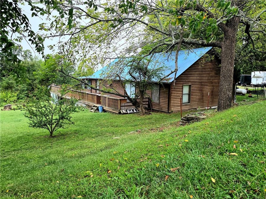 This is a lovely log home sitting on 2 acres with 3 bedrooms 2 baths and a large sunroom, having over 1600 square feet, metal roof, newer HVAC, and wrap-around deck. With its proximity to Jasper, possibilities might also include nightly rental.