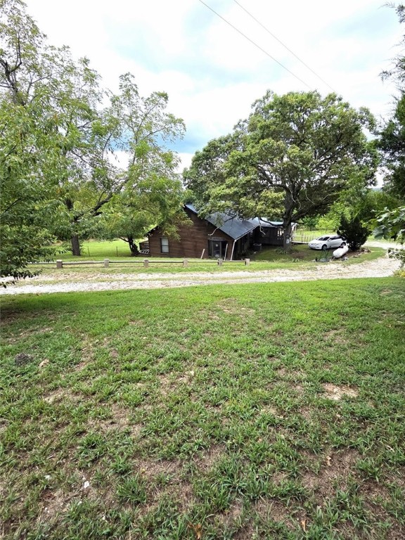 This is a lovely log home sitting on 2 acres with 3 bedrooms 2 baths and a large sunroom, having over 1600 square feet, metal roof, newer HVAC, and wrap-around deck. With its proximity to Jasper, possibilities might also include nightly rental.