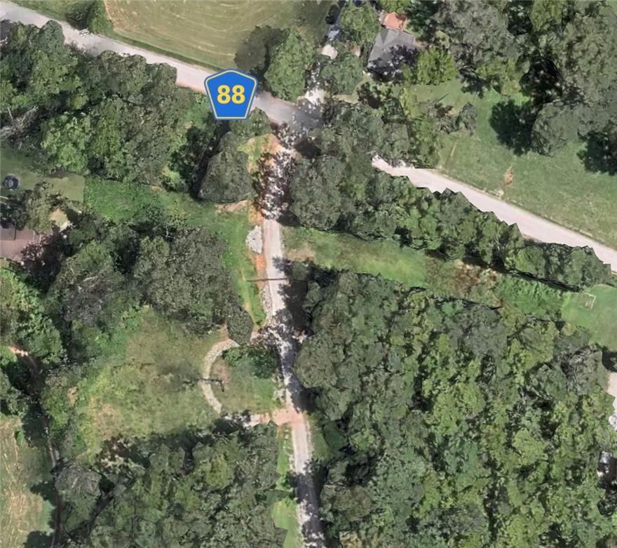 Rare opportunity to own just over 3 acres in a gated rural subdivision, priced well below comparable properties. This wooded tract offers the perfect balance of privacy and readiness, with a cleared homesite and established circle driveway already in place. Utilities are a major plus—electricity and water are on-site, saving time and upfront costs. The property has been perc tested for a 5-bedroom home, with results available, making it ready for your custom build (septic required). Enjoy a secluded setting while still benefiting from convenient access to the new bypass connecting Highway 412 and 612, providing an easy commute to nearby amenities. Don’t miss your chance to secure land with this level of preparation and value!