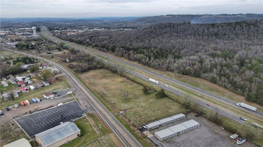 This 3+ acre commercial property offers exceptional visibility, accessibility and development potential. Ideally located between U.S. Highway 64 and Interstate 40, the property benefits from steady traffic flow and convenient access to one of the region’s most heavily traveled transportation routes.
This site presents an opportunity for investors, developers or businesses seeking a highly accessible location with strong growth potential. With generous acreage and a flexible layout, the property is well-suited for a wide range of commercial uses including retail, hospitality, service businesses, storage facilities or mixed-use projects. The proximity to Interstate 40 provides regional access while Hwy 64 offers excellent local exposure, making this an ideal location to capture both local and highway traffic. Utilities are available in the area, and the size of the parcel allows for multiple development configurations.
This property offers the space, access and visibility to support a successful commercial venture.