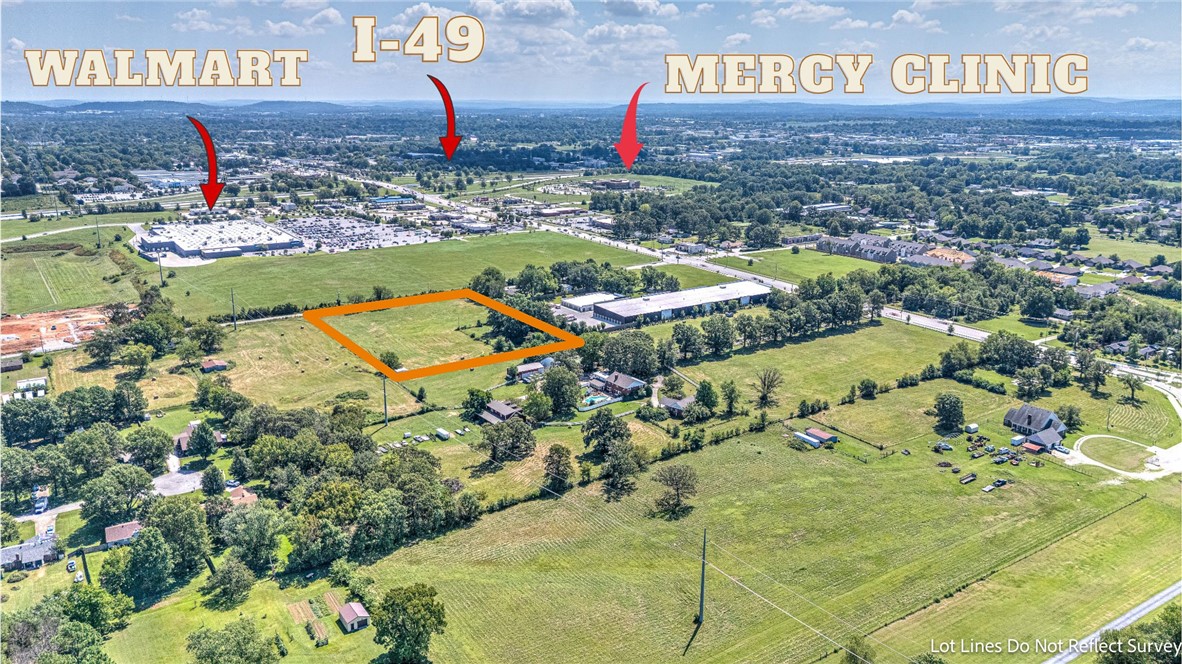 This prime tract of land offers outstanding commercial potential in a highly visible and accessible location. With approximately 380 feet of road frontage, the property ensures excellent exposure for future businesses. The photos showcase expansive open acreage with a level terrain, ideal for development and easy site preparation. Situated in a rapidly growing area, this site benefits from increasing demand and ongoing development in the surrounding community. Road access and nearby infrastructure make it a strong candidate for retail, office space, or mixed-use projects. The images highlight both the cleared portions and the natural surroundings, offering flexibility for creative site planning. With its blend of accessibility, visibility, and development-ready characteristics, this land presents a unique opportunity for investors, builders, or businesses seeking a strategic location for growth