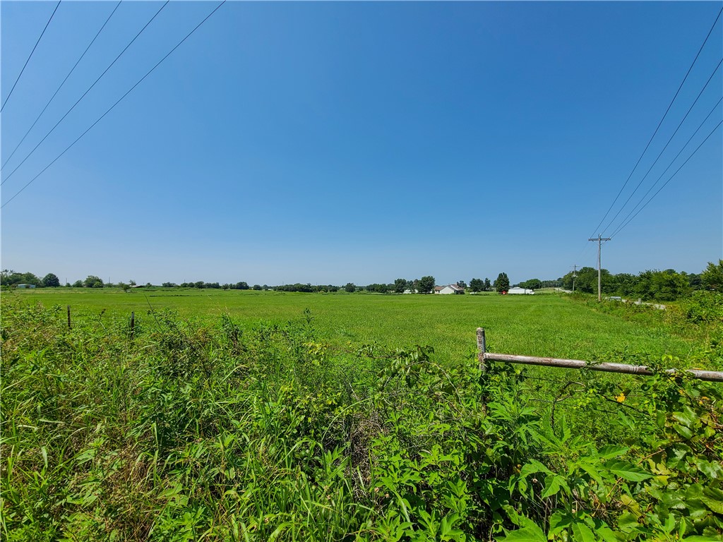 2.5 acres of agri-land 5 minutes to Gentry city center. 330' of frontage along WPA Rd. Great development potential for dream home or farm land. 15 minutes to Northwest Arkansas National Airport and 30 minutes to Bentonville. 5 acres to the west under contract. Water & electricity at street. Rural property. Flat & clear land. Any modular, mobile (double-wide only) or manufactured home must have a foundation.