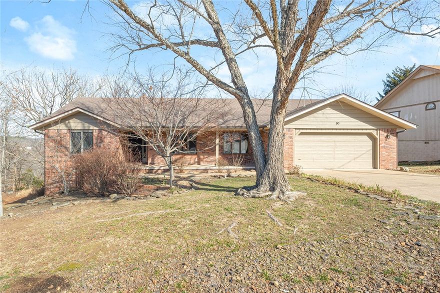 Well built, well maintained home in an incredible location! .27 acre vacant corner lot next to this home can also be sold, separately. This lot has a recent 3 bedroom occupancy perc test report. Floor plan offers TWO living spaces, an oversized enclosed sunroom overlooking private POA common property...so much room for flexible living! Located just walking or biking distance to Scottsdale Golf Course and the Loch Lomond dam. Kitchen cabinets, countertops and appliances are upgraded, refrigerator conveys. Large workshop with utilities offers small storm shelter and plenty of space for hobbies or storage. Bella Vista is one of the most thriving communities in NW Arkansas, do not miss your opportunity to own this home!