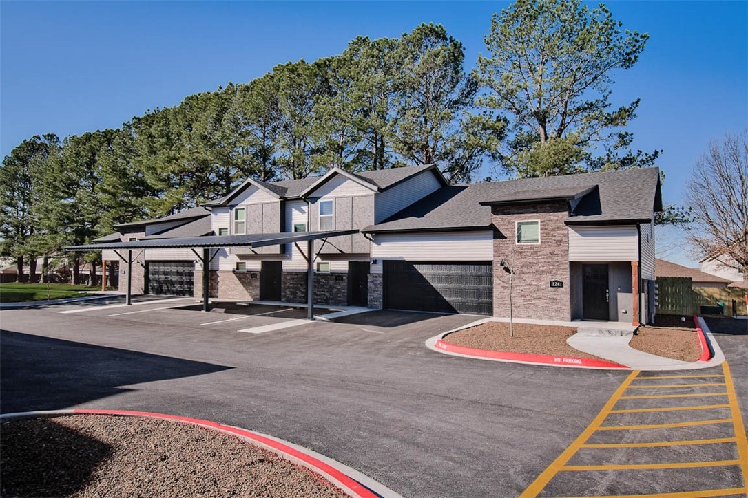 New Construction townhome in perfect Fayetteville location. Close to the U of A, shopping, trails, I-49 & all NWA has to offer! 2 beds, 2.5 baths. Large main floor living area, laundry, ½ bath and kitchen. Bedrooms are located upstairs & have private baths. LVP flooring in main areas, carpet on stairs & in bedrooms; ceiling fans in bedrooms & living room area. Kitchen has all stainless appliances. Refrigerator & full-size washer & dryer are included with sale. Bluetooth speaker system in living area & on covered porch; wifi cameras for security. Two dedicated covered parking spaces with solar lights for added security. Located along UA bus route 35. Acreage listed is for total complex not individual units, individual unit acreage determined by legal description. Each HPR unit will have $600 annual HOA fees for minor maintenance. Entrances are deed ingress and egress at 3 separate locations. HOA documentation available for review. Taxes are estimated and based on what was paid prior to development.