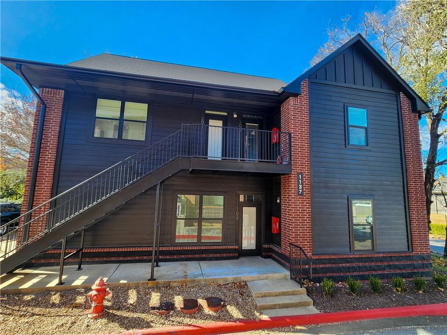 Sold Before Print - North Corner Condos. Newly renovated & just steps from the University of Arkansas, North Corner Condos is a boutique 19-unit community perfect for students or investors. Unbeatable Location: Very close walking distance to University of Arkansas, Razorback Greenway, Dickson Street, Goat Lab Brewery/Restaurant shops, & bus stop at your door. Fully Renovated: New roof, windows, paint, gutters, and HVAC—move-in ready & low-maintenance. Modern Interiors: 3 designer packages include granite counters, premium fixtures, full appliance sets. Secure Living: Owner-only access to upper floors, keyless entry, cameras, & fire suppression system. Whether buying for your student or as a smart investment, North Corner Condos offer prime real estate in Fayetteville’s most desirable student hub. Multiple units with several different floor plans available. 2 and 3 bedrooms, all 2 full baths. Images featuring staged furniture depict model units. Individual units may vary in layout and finish.