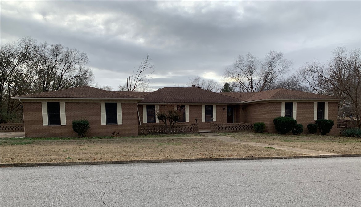 Spacious home that needs a lot of work. Will be sold as is. Oversized primary bedroom with walk in closet. Covered deck overlooking large backyard with backyard access to a down stairs additional garage. Basement area has 2 bedrooms, full bath and large family room. Do not go on deck as it is unstable where there is tile.