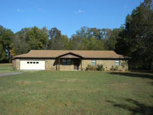 PRICED TO SELL...Nice 3 bedroom 2 bath brick home on 2.5 acres less than 5 minutes from town. This home features a large living room, spacious kitchen, & oversized laundry room with additional storage. Additional outbuildings include a 20x24 garage/shop with bay door, 16x20 barn with lean-too, & tool storage building. Nice mature shade trees to enjoy and good garden spot. Great price at $118,500.