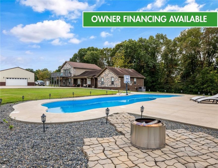 Experience modern country living on 30 fully fenced acres in Pea Ridge. This 3500 sq ft home blends refined finishes with functional acreage. The open floor plan features an updated kitchen with new cabinetry, fixtures, and Cafe Collection appliances (including refrigerator with built-in espresso feature). Split layout with 3 bedrooms, 2.5 baths The oversized primary suite showcases a spa-style wet room that combines a freestanding tub and walk-in shower. Upstairs, a versatile bonus room includes built-in desks, bar, and new half bath. Outside, enjoy an in-ground pool with a covered gazebo, ideal for relaxing or entertaining with views of rolling pastures. The 3500 sq ft heated/cooled shop (renovated/expanded in 2024) and brand-new barn with 4 stalls with fence runs, tack room, and feed room. All this with a new hay barn and water spigots throughout, and 3 cross pastures make this property ready for horses or livestock. 3 New HVAC-new water heater w/ insta-hot, new propane tank (recently refilled), well, cox fiber