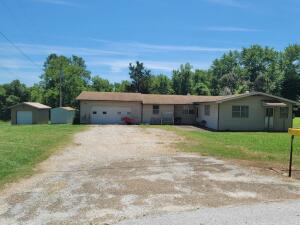 Nice Sq Footage on this home on 1.89 acres M/L. Home could be 4 or 5 bedroom if needed. Home has nice large 2 car attached garage and 12x16 detached one car garage/workshop. Covered back deck, raised garden beds, hardwood floors, home could be Air B&B with 5 bedrooms and only 20 minutes from Buffalo National River. Lots of possibilities!