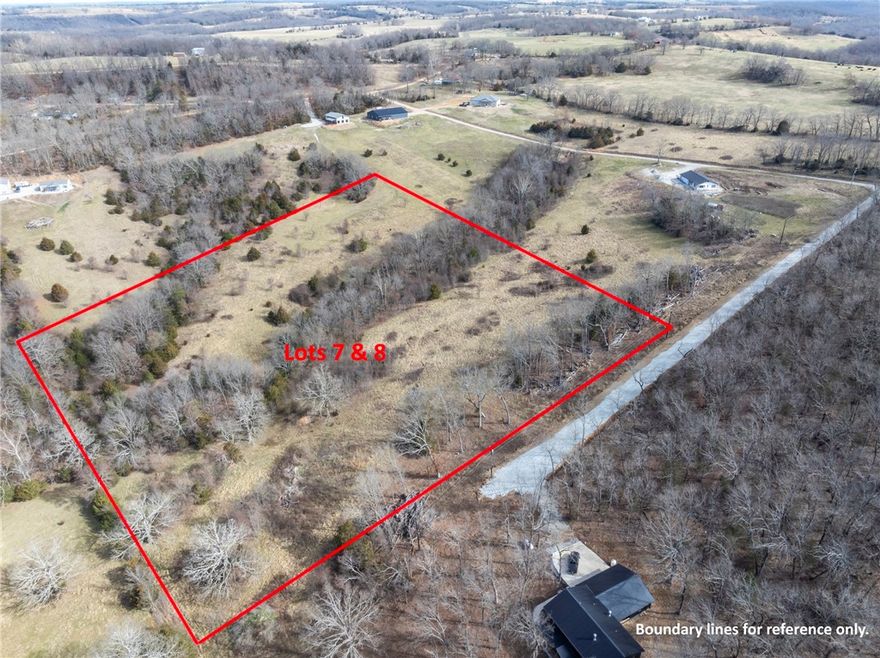 Build your dream home on this expansive 7-acre lot, nestled in a peaceful rural subdivision. This property has two parcel ID numbers, mature trees and wide open spaces, a perk test has been provided. No mobile homes allowed. Come feel the classic charm this countryside has to offer. Located at the end of a cul-de-sac.  Call today for your private showing.