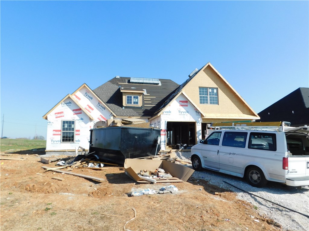 Wonderful new 4 bedroom, 3 bath, 3 car garage home in new Liberty Estates subdivision. This 2500 sq ft home has an open floor plan with an inviting spacious covered back porch. Downstairs is a separate study/office and the upstairs large 4th bedroom could be used as a bonus room. Currently in the Har-Ber School district with easy access to I-49. Neighborhood pool and club house are scheduled for spring of 2018. Tons of quality features. Come take a look.