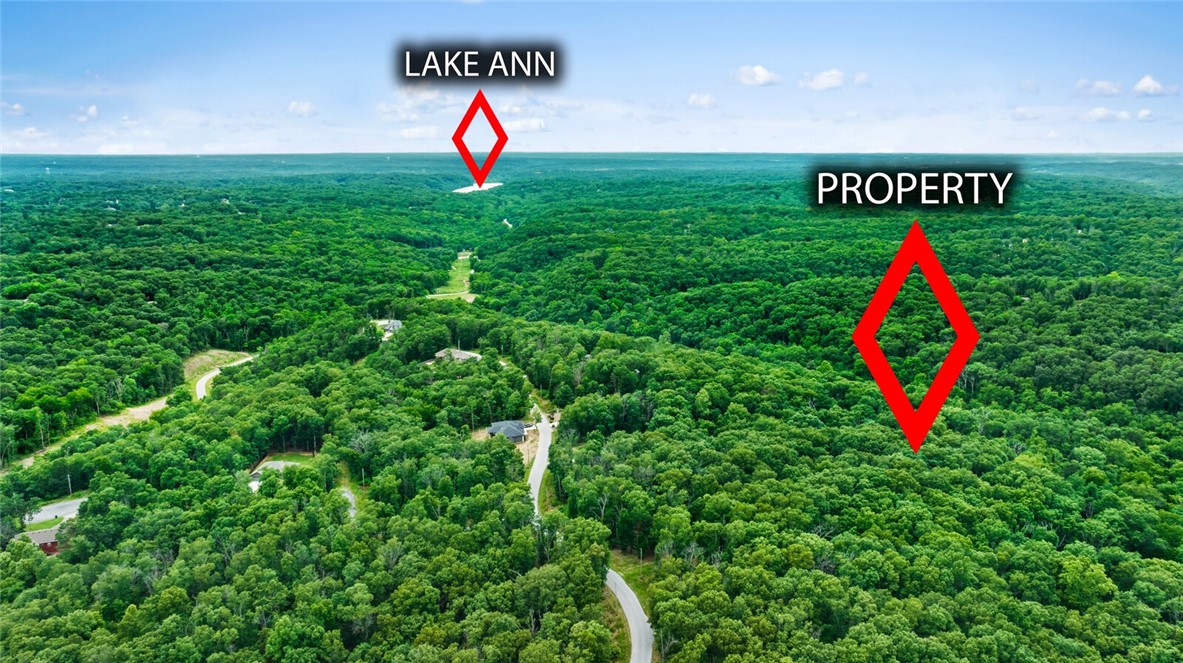 Build your dream home on one of the rare, mostly flat/gently sloped 0.61 acre wooded lots in Bella Vista! Just steps from top hiking and biking trails, this serene location is adventure-ready. The lot supports a 4-bedroom home and includes a perc test, septic design, survey, and house plans. Don't miss this rare chance to build in on of NWA's most sought-after areas!