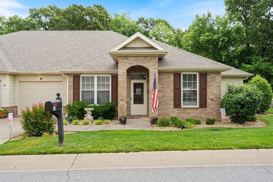 Welcome to Highland Park Villa—the perfect place for a "lock and leave" lifestyle! This beautifully maintained townhome the ideal blend of comfort, convenience, and community in one of the most sought-after neighborhoods in Bella Vista. Let the Townhouse Association take care of the yard work while you enjoy everything the area has to offer. Whether you're heading out for a nature walk, meeting neighbors at the clubhouse, or relaxing poolside, this home provides the perfect home base for easy living. Step inside to be greeted by serene wooded views, perfect for nature watching and unwinding in peace. The updated eat-in kitchen features modern finishes, including quartz countertops, updated appliances, and ample storage. Just off the kitchen is a formal living room with a gas log fireplace flanked by custom bookshelves—creating a warm and inviting space. One of the home’s highlights is the sunroom, filled with natural light and overlooking a spacious, east-facing deck and patio.
