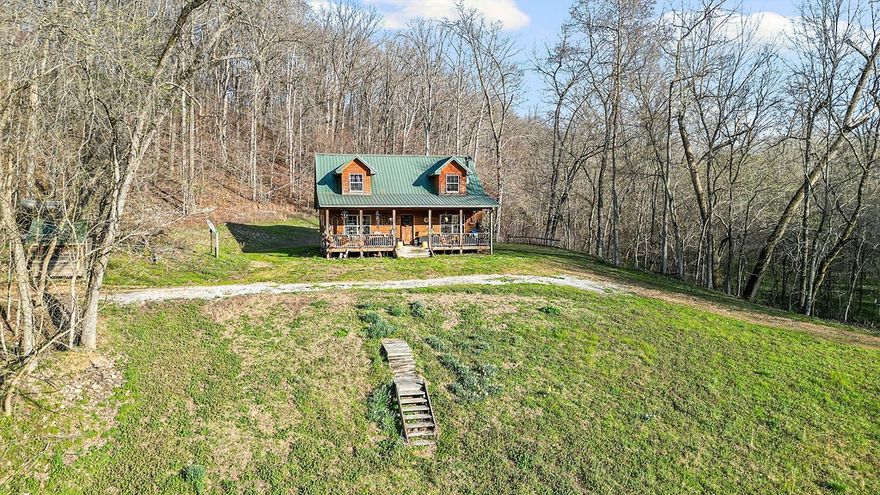 Your dream of owning a private Arkansas retreat starts here. Set on nearly 40 acres, this charming cedar cabin is the kind of property that rarely comes available. With a year-round stream, striking rock bluffs, wooded privacy, and plenty of room to roam, this land is ideal for anyone craving peace, adventure, and space to breathe. The 3-bedroom, 2-bath home is full of rustic character and sits in a setting that feels straight out of the Ozarks. Whether you want a forever home, weekend getaway, hobby farm, or hunting property. This property is filled with abundant wildlife, yet still has plenty of room for livestock. This property has access to year-round moving water via the spring-fed stream. The house is on city water, but still has the existing well, which can be used for watering livestock or gardens.
