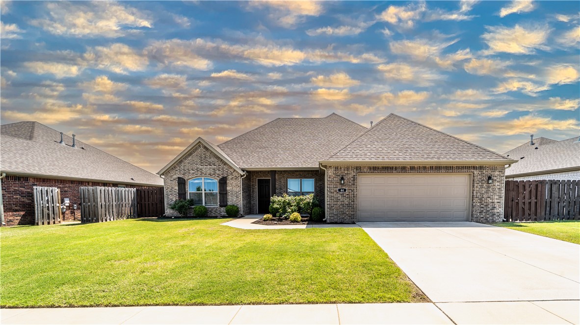 Beautiful brick & stone 4 Bedroom. Open concept. Hard Wood Floors in living room, entry, kitchen & dining. 4th bedroom currently used as an office. Seller will convert closet to include a hanging rod with acceptable offer upon request. Large center island in kitchen with seating space, farmhouse sink, and pantry. Great split plan with 2 full baths. New carpet in bedrooms installed in 2025. Washer, dryer, and refrigerator can convey with acceptable offer upon request. Beautiful large primary suite with raised TV outlet. Primary bath has a huge handicap accessible walk in shower with rain head and huge walk in closet. Nice covered and extended patio and full privacy fenced yard. 2 car garage. Call this home yours today! Check out the 3d tour!