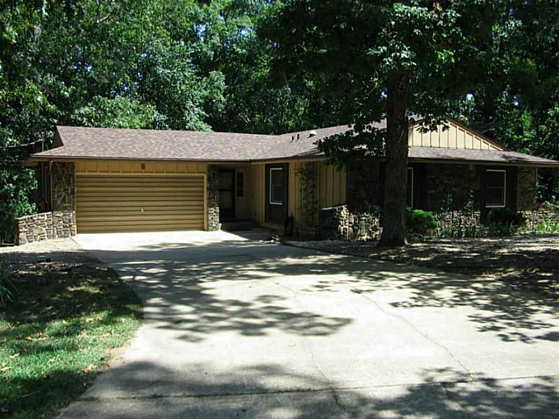 DON'T BE FOOLED BY THE AGE. NUMEROUS UPDATES INCLUDING: NEW ROOF, TRANE HEAT & AIR, ANDERSEN WINDOWS, NEW CARPET IN TWO BEDROOMS, BAMBOO FLOORING IN 3RD BEDROOM & SUNROOM, STAINLESS STEEL APPLIANCES INCLUDING WASHER & DRYER, RAISED PANEL WOOD DOORS.,VERY UNIQUE SUNROOM, STORAGE BELOW, AND ALL OF THIS ON A 3/4 ACRE LOT WITH A VERY CONVIENIENT LOCATION. LOCKBOX IS ON LEFT SIDE OF GARAGE ON FLAG HOLDER. LOCKBOX IS ON LEFT SIDE OF GARAGE ON FLAG POLE HOLDER.