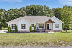 A 3-bedroom, 2-bathroom home with a split floor plan offers an ideal solution for both families and individuals looking for space and privacy. This thoughtfully designed layout places the large master suite on one side, creating a serene retreat away from the other two bedrooms, perfect for parents seeking tranquility. The spacious master bedroom, complete with an expansive walk-in closet, provides ample storage and a touch of luxury.One of the standout features of this home is the cozy fireplace, serving as a focal point in the living area. Whether it's a chilly winter evening or a casual gathering with friends, the fireplace creates a warm and inviting ambiance.