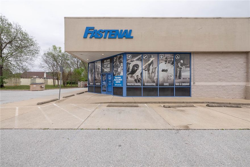 Major Road Frontage (2022 traffic count = 14,000 daily), Near Trails, Neighborhood  (Near Biking, Paved, Walking Trails).  The building contains approx. 6,700 sf, with 12' high ceilings and is clear span throughout. The building is a "blank slate" and can re-purposed with minimal interior demolition. 33 on-site parking spaces. Approx 1/4 acre park-like setting behind the building. Great location in rapidly growing SoFay (south Fayetteville). Across the street is the South Yard project, consisting of 128 apt units plus retail, food, & beverage, & other businesses. Adjacent to the sw are the Varsity House and Grove apartments, consisting of 224 units. Immediately to the east and north are hundreds of relatively new attached and detached housing units. Downtown Fayetteville, Fay High Sch. and the Univ of Arkansas are all just a short drive away. 1/2 block from the Razorback Greenway Trail.