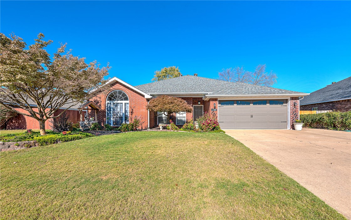 DISCOVER THIS INVITING 4-BEDROOM, 2-BATH HOME IN A PRIME ROGERS LOCATION...just 4 miles from the new Walmart Home Office & minutes from top-rated schools, shopping centers, restaurants, trails & I-49! Inside, youāll find a thoughtfully designed layout with open concept living featuring custom finishes such as wood flooring, wainscoting, built-ins, & hard surface flooring throughout! The spacious living area with a wall of built-ins & dual-sided gas fireplace that's shared with the new charming sunroom featuring lots of natural light & access to the cozy backyard! Gorgeous curb appeal with extensive landscaping & a huge outdoor space with multi-level patio spaces & raised garden! Wood flooring & wainscoting in main living areas! Large kitchen with oversized bench seating creating a warm & inviting space for family gatherings. NEW ROOF & FENCE 2024! NEW PAINT! Walk to trails & the community park & playground! This meticulously maintained home is a TRUE GEM!! Don't miss out on your opportunity to see this charmer!!
