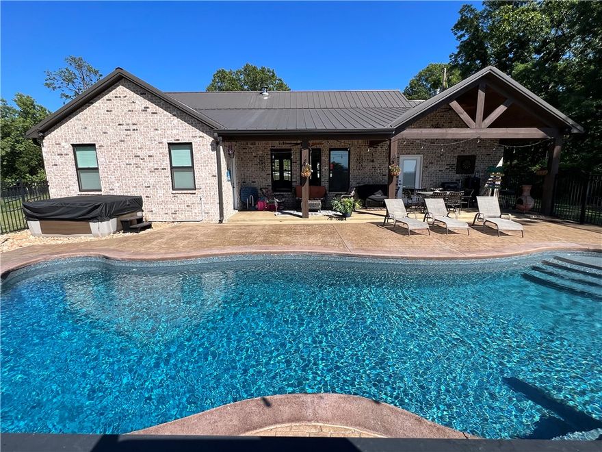 Private Ozark Estate!! 1,808 SQFT home with in-ground pool and 15.83 acres m/l plus 856 SQFT guest house!! End of the road privacy, artisan spring, solar system with battery backup, greenhouse and fenced garden area all with beautiful Ozark Mountain views! The 3BR-2.5 BA main house is all brick, built in 2020, and features cathedral ceilings, granite countertops, a wood stove, tankless hot water heaters, porcelain tile flooring, Jack and Jill bathroom, and a concrete safe room. The salt water pool measures 40x16 and 9 feet at its deep end. The hot tub also conveys. The 1BR-1BA guest house was built in 2019, has CH&A, an office and stained concrete floors. Both homes have metal roofs. The land features approximately 6 acres of fenced pasture, 20x40 barn, storage building, with established pear and peach trees and blueberry bushes. 15 minutes to Harrison and 20 minutes to Branson.
