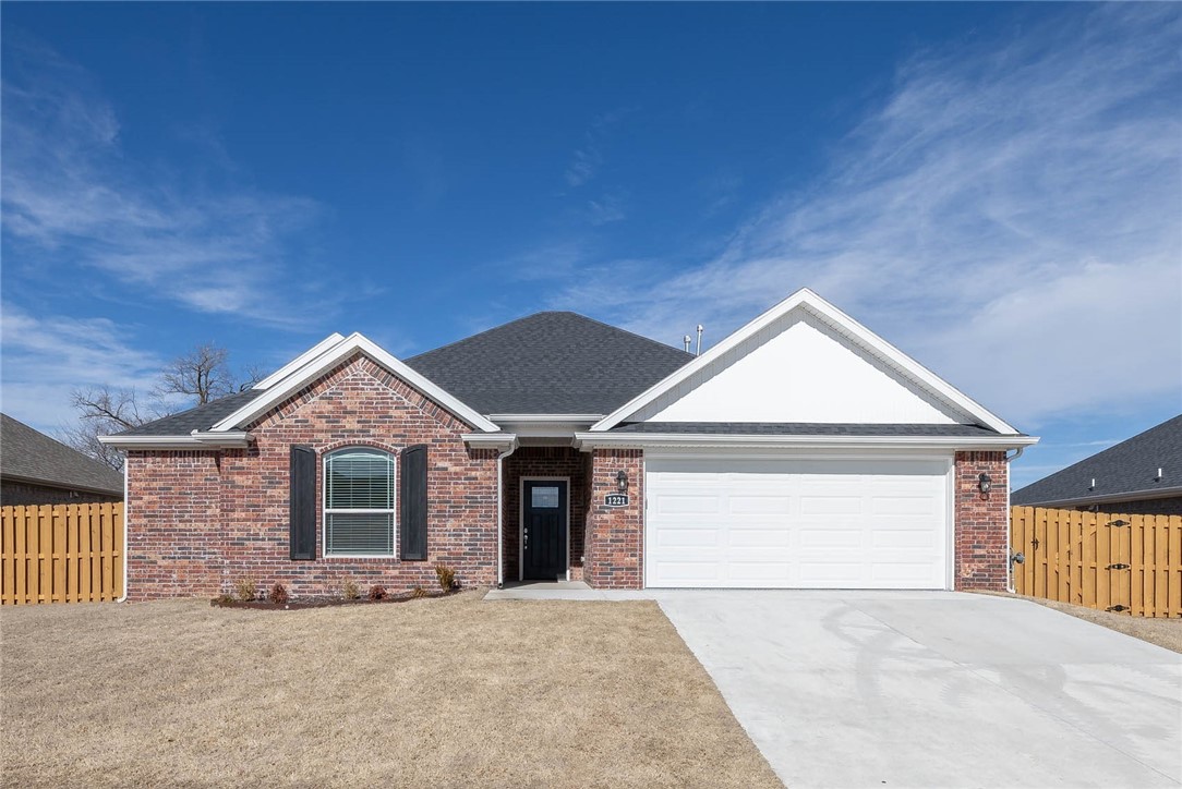 This like newĀ brick home boasts a split floor plan and an inviting open layout. Features include a cozy gas fireplace, elegant crown molding in the living room and primary bedroom, luxury vinyl plank flooring and carpeted bedrooms. The kitchen offers stainless steel appliances including a gas range, island for prep, granite countertops, large walk-in pantry, and ample cabinets.Ā The spacious primary suite has a whirlpool tub, tiled walk-in shower, and plenty of space in the walk-in closet.Ā Enjoy stepping out on the covered patio for relaxing, grilling and entertaining; complemented with a large, fenced back yard.Ā Additional highlights are a separate utilityĀ room, epoxy garage floor, upgraded commodes, cedar fence, and proximity to all NWA has to offer!
