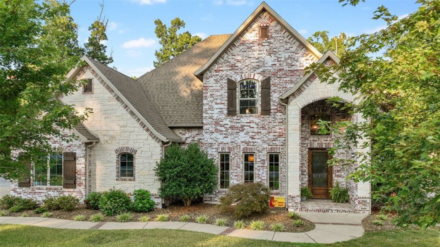 This private, wooded home and acre in the Versailles neighborhood is perfect for gathering loved ones—just minutes from downtown Bentonville and Walmart HQ. Inside, light-filled, open spaces make life easy. The chef’s kitchen, with granite countertops, dual sinks, stainless appliances, and a 36” pro gas range, anchors the home. The main-floor primary suite offers a walk-in shower, jetted tub, dual vanities, and a closet connected to the laundry. Also on the main level: a formal dining room, office, half bath, three-car garage, and inviting living room with beams, brick, and fireplace. Upstairs, three bedrooms with walk-ins, two baths, and a media room with projector and kitchenette await movie nights and sleepovers. Outside, enjoy a covered patio with grill, salt and vinyl liner pool with waterfall, and lush landscaping. An expanded driveway offers plenty of parking for entertaining.