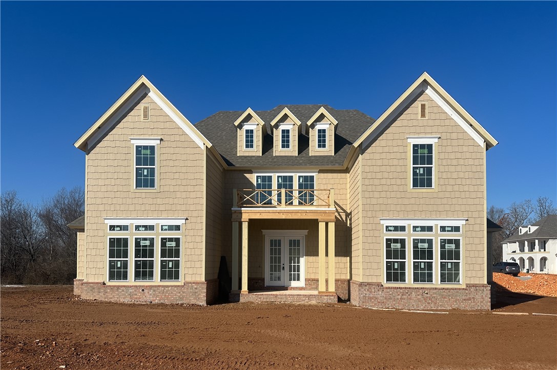 Welcome to this new single-family home in Fayettevilleās peaceful Blackberry Ridge, designed by Lane Crosno Designs. Upon entry, you'll enter the living area and be greeted by a two-story ceiling. To your left is the open kitchen and dining room, and to your right is the master bedroom. Through the living area leads onto the covered back patio with a courtyard. The kitchen features an island, quartz countertops, and Cafe appliances. Engineered hardwood floors extend through the main areas including downstairs bedrooms and stairs. The ownerās suite offers a walk-in closet, and spa-like bath with dual vanities, walk-in shower, freestanding tub, and private water closet. Upstairs, youāll find three bedrooms and two additional bathrooms. The split three-car garage is prewired for an EV charger, and the covered porch has a natural gas line and CAT6 hookup. *Agent Owned*