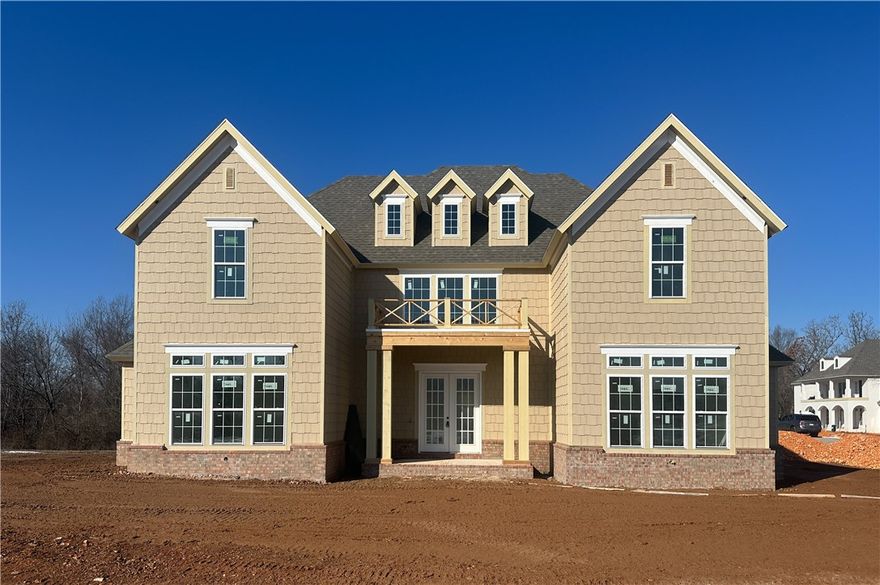 Welcome to this new single-family home in Fayetteville’s peaceful Blackberry Ridge, designed by Lane Crosno Designs. Upon entry, you'll enter the living area and be greeted by a two-story ceiling. To your left is the open kitchen and dining room, and to your right is the master bedroom. Through the living area leads onto the covered back patio with a courtyard. The kitchen features an island, quartz countertops, and Cafe appliances. Engineered hardwood floors extend through the main areas including downstairs bedrooms and stairs. The owner’s suite offers a walk-in closet, and spa-like bath with dual vanities, walk-in shower, freestanding tub, and private water closet. Upstairs, you’ll find three bedrooms and two additional bathrooms. The split three-car garage is prewired for an EV charger, and the covered porch has a natural gas line and CAT6 hookup. *Agent Owned*