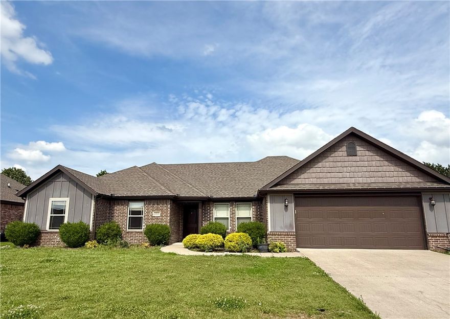 Welcome to this beautiful home in sought-after Sienna Estates, offering an ideal blend of comfort, style, and location. Just 10–15 minutes from the Bentonville Square, the new Walmart Home Office, and close to top-rated schools, this home sits in a prime spot for convenience and connection. Enjoy access to fantastic community amenities including a pool, playground, and clubhouse. Inside, you'll find an open floor plan with cathedral ceilings, a spacious living room with a gas log fireplace, laminate wood floors, and a large kitchen featuring granite countertops, abundant cabinetry, and an eat-in nook. The formal dining room includes elegant wainscoting, while the primary suite boasts a whirlpool tub and generous walk-in closet. A covered patio and fenced backyard complete this move-in-ready home!
