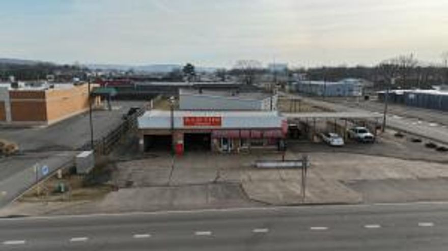 Don't miss this incredible opportunity to own 8,000 square feet of commercial space on 1.13 acres in the heart of Russellville. Situated in a heavily traveled area, this property offers maximum visibility and accessibility, making it ideal for a variety of businesses, including retail, office, restaurant, medical, or redevelopment projects.With ample on-site parking, excellent frontage, and close proximity to major roads and highways, this property is perfectly positioned for success. Whether you're an investor or a business owner looking for a high-exposure location, this is a rare opportunity to secure prime commercial real estate in a growing market. VIEWING ONLY DURING BUSINESS HOURS