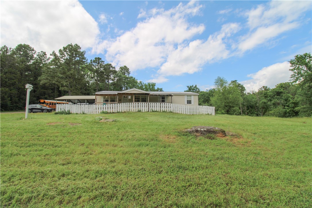 Discover the perfect blend of comfort and versatility in this charming 3-bedroom, 2-bathroom home, nestled on 3 picturesque acres. This property is designed to accommodate your lifestyle, with two additional bonus rooms that can be transformed into an enclosed patio, home office, or even extra bedrooms to suit your needs.
Entertain or unwind in two spacious living areas, one featuring a warm wood-burning fireplace that creates an inviting atmosphere for family gatherings and cozy evenings. The layout promotes both relaxation and functionality, making it ideal for everyday living.
The expansive outdoor space is a true highlight, complete with multiple outbuildings for storage or hobby pursuits. The property is partially fenced for pets while also offering plenty of room for gardening or other outdoor activities.
This home is more than just a place to live; it’s a lifestyle waiting for you to embrace. Schedule your private tour today and explore all the possibilities this beautiful property has to offer!