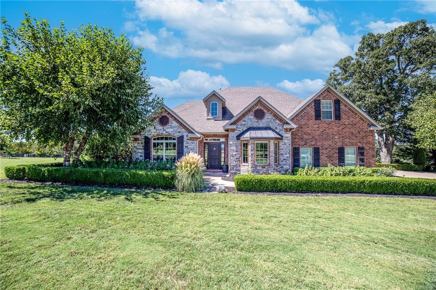 Country feel with city conveniences. Sitting on 1.51 acres with mature trees and lush landscaping. Escape to the country life after a long day and watch the sunset from your screened in back porch. From the entry and throughout, every room in this home is spacious. No need to get rid of furniture, the living room will accommodate the biggest of sofas. Step into your kitchen with walk-in pantry, gas stove, hood vent, pot filler, stainless appliances, touchless faucet, breakfast bar and dining area. The owner's suite has a sitting area overlooking backyard with walk-in closet, linen closet, 2 sinks, jetted tub, walk-in shower. Wood floors throughout the home with carpet in the bedrooms. Split floor plan with 2 bedrooms, 2.5 bathrooms downstairs and 2 bedrooms, 2 full bathrooms upstairs. All bedroom closets are generously sized walk-in closets. Upstairs you'll also find the incredibly large bonus room. Additional amenities included: security, sprinkler, central vac and epoxy floor in garage.