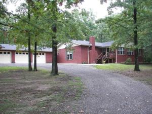 Country living less than 10 minutes from the city. 3 bedroom home sits on 12 wooded acres and features 2636 of living space, a large den and fireplace, 3 car garage and a covered patio and deck to enjoy all the wildlife. The huge 28X60 shop is one of a kind. So bring the boat, and all the other toys and still have room for a mancave. Pond and pole barn also