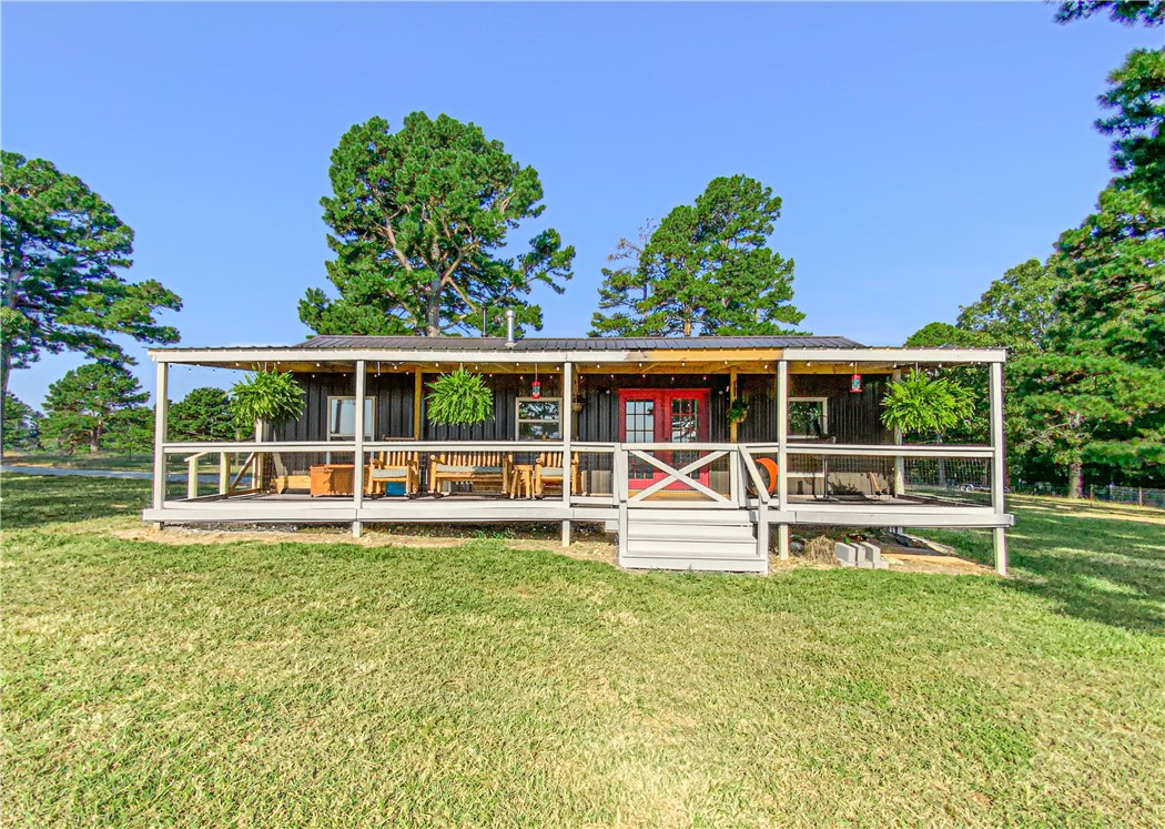 Discover your own slice of paradise on this dreamy 40-acres m/l with 2 homes, a pole barn, perimeter and cross fencing, cleared land, and ponds! This property is so rare and full of natural beauty. Whether you are seeking a peaceful retreat, a farm to call yours, or ample space for outdoor activities and relaxation, this is a property you don't want to miss! The 2 houses are full of modern touches and country feels that will make you feel right at home! The barndominium has 2 bedrooms, 2 bathrooms, and an open floor plan. The modern tiny house on the back of the property has 1 bedroom and 1 bathroom and an open floor plan as well. This is a once-in-a-blue-moon opportunity!