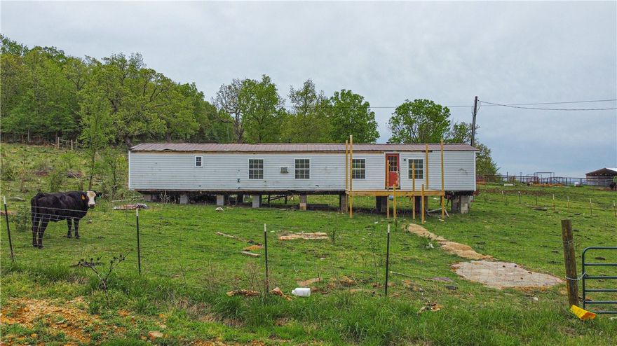Currently is a successful cattle operations with 3 ponds that have never gone dry.  Barn is large enough for hay supply for the toughest winter. Existing well that has not been used by current owner. Electricity available for single wide that could be refurbished for living quarters or safe dry storage.