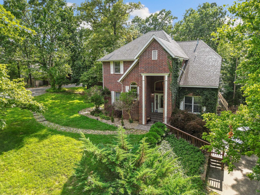 Beautiful, well-maintained, custom-built home on 2.02 acres. Located 2 minutes from Lake Atalanta and 5 minutes from downtown Rogers. Close to the Railyard and all the surrounding biking and hiking trails. Beaver Lake is minutes away. This house features a vaulted entryway leading to 2 living areas. The main living room opens to a large country kitchen; a chef's delight, featuring a large central island, extra sink, and a beautiful JENN-AIR gas stove/oven. There are 4 bedrooms, 3.5 baths plus another bedroom-sized room downstairs, plus a bonus room/man cave located off of the garage. There are 2 beautiful gas/wood burning fireplaces (one in the living room and one in the primary upper-level bedroom).
Lovely, well maintained front yard and large fenced back yard and woods provide natural beauty and privacy. The upper and lower decks make this a great house for entertaining, both indoors and out.
House has a dumbwaiter!
New water heater- June '20
New garage door- Jan. '21
New HVAC (two units) Jan. '22