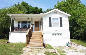 Looking for your first home? This adorable 2BR/1BA home has a large kitchen and dining room, tons of character, original wood and new laminate flooring. Large walk in closet in Main bedroom. Dry, partial basement is extra clean and great for tons of storage! Cute porch in back shaded by huge tree! Must see this wonderful home!